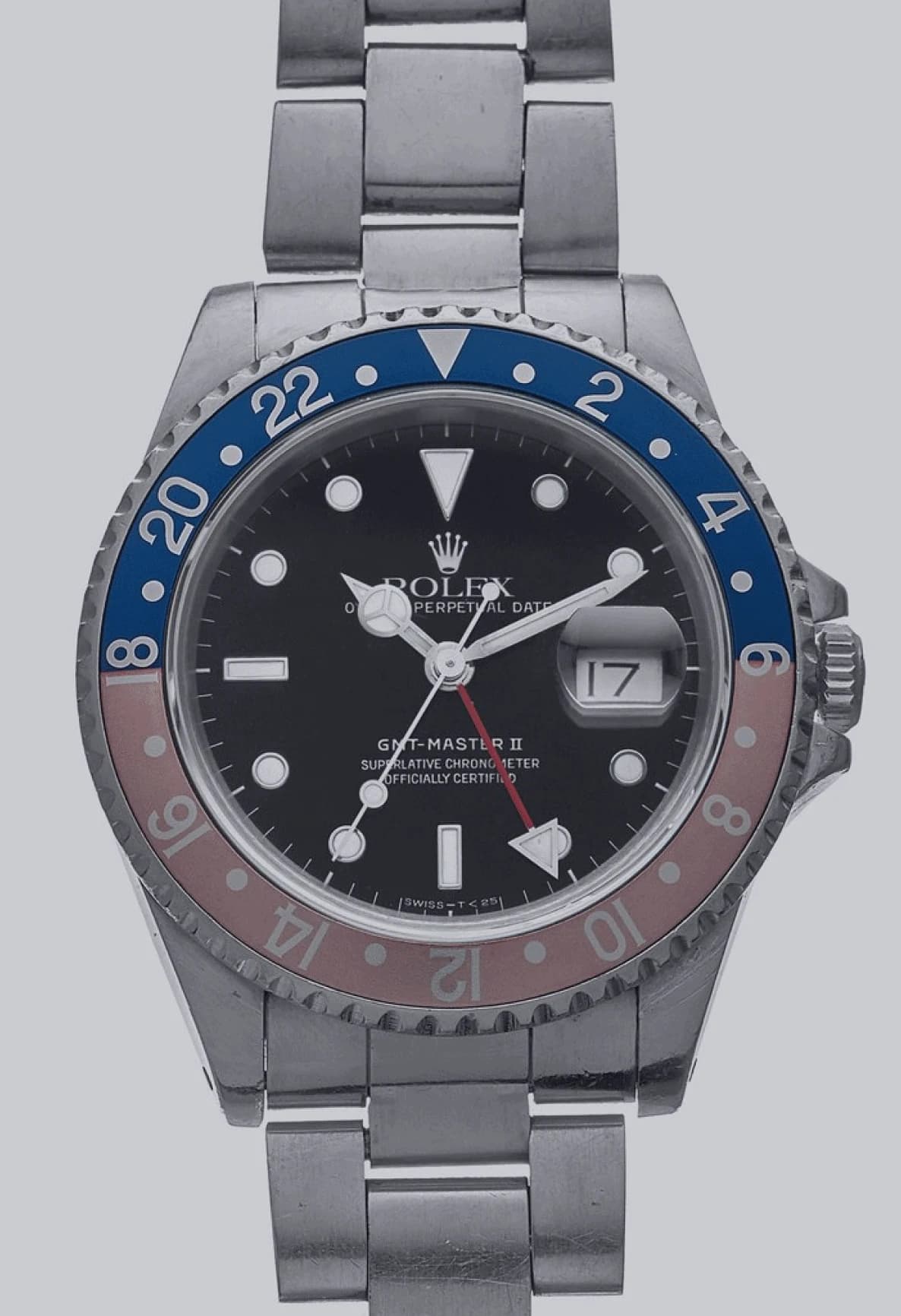 Steel watch with a blue and faded red 24-hour bezel, black dial and magnified date window